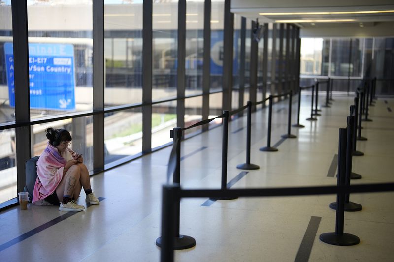 Lacroix Winget, of Waterloo, Mich., waits on her flight home at the Philadelphia International Airport, Wednesday, July 3, 2024, in Philadelphia. (AP Photo/Matt Slocum)