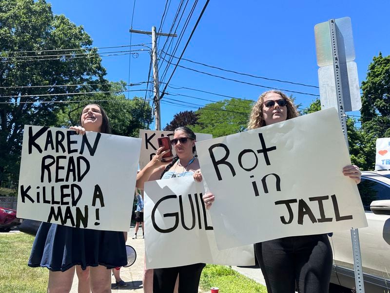 A half-dozen people supporting the O'Keefe family heckled Karen Read supporters and called for her conviction in her murder trial, Friday, June 28, 2024, in Dedham, Mass. Read, 44, was charged with second-degree murder after being accused of running into her Boston police officer boyfriend with her SUV in the middle of a nor'easter and leaving him for dead after a night of heavy drinking. (AP Photos/Michael Casey)