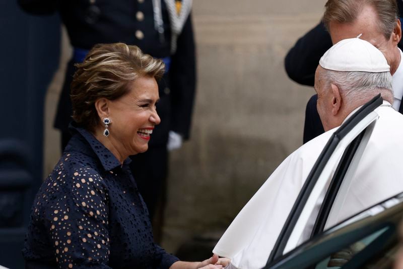 Pope Francis is welcomed by Grand Duchess Maria Teresa, left, and Luxembourg's Grand Duke Henri, right, at the Grand Ducal Palace in Luxembourg, Thursday, Sept. 26, 2024. (AP Photo/Omar Havana)