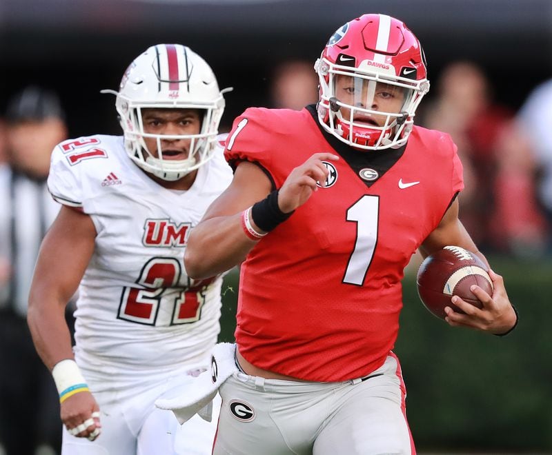 Georgia quarterback Justin Fields breaks away from Massachusetts in 2018.  Curtis Compton/ccompton@ajc.com