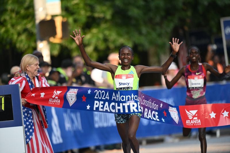 Stacy Ndiwa crosses the finish line with a time of 31:12 during the 55th running of the Atlanta Journal-Constitution Peachtree Road Race on Thursday, July 4, 2024.  ( Hyosub.Shin / ajc.com)