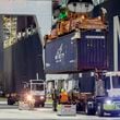 FILE - Five ship to shore cranes and gangs of longshoremen work the container ship YM Witness at the Georgia Ports Authority's Port of Savannah, Sept. 29, 2021, in Savannah, Ga. (AP Photo/Stephen B. Morton, File)