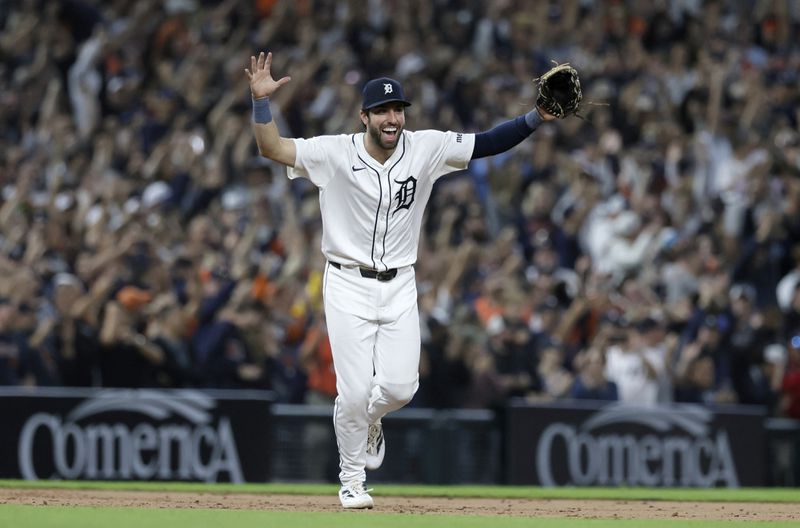 Detroit Tigers' Matt Vierling celebrates after defeating the Chicago White Sox to get into the playoffs in a baseball game, Friday, Sept. 27, 2024, in Detroit. (AP Photo/Duane Burleson)