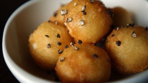 Fried goat cheese with honey and black pepper at Ecco. / AJC file photo