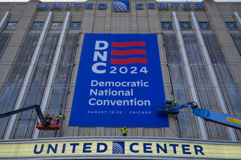 Signage is hung on the exterior of the United Center in preparation for next week's Democratic National Convention in Chicago on Wednesday, Aug. 14, 2024.(AP Photo/Pablo Martinez Monsivais)