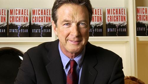 FILE - Author Michael Crichton poses for a portrait at The Peninsula Hotel in New York on Dec. 7, 2004. (AP Photo/Jim Cooper, File)