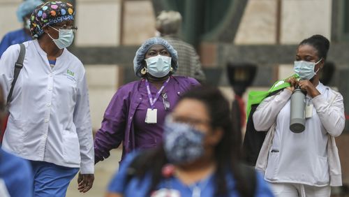 Grady hospital medical workers leave the hospital after their shifts from the hospital in downtown Atlanta on April 8, 2020. JOHN SPINK/JSPINK@AJC.COM