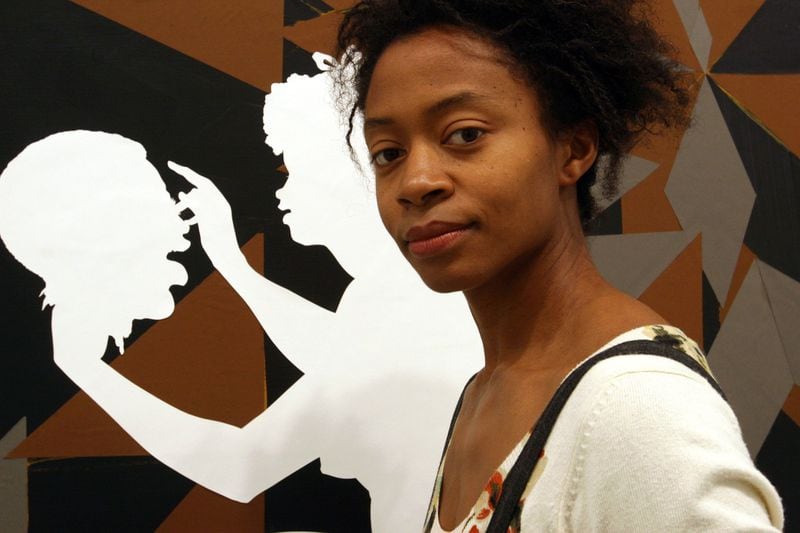 Contemporary artist Kara Walker frequently uses cut-paper silhouettes, a technique from the 19th century, to comment on and to subvert the attitudes of the era. AJC FILE PHOTO / 2007