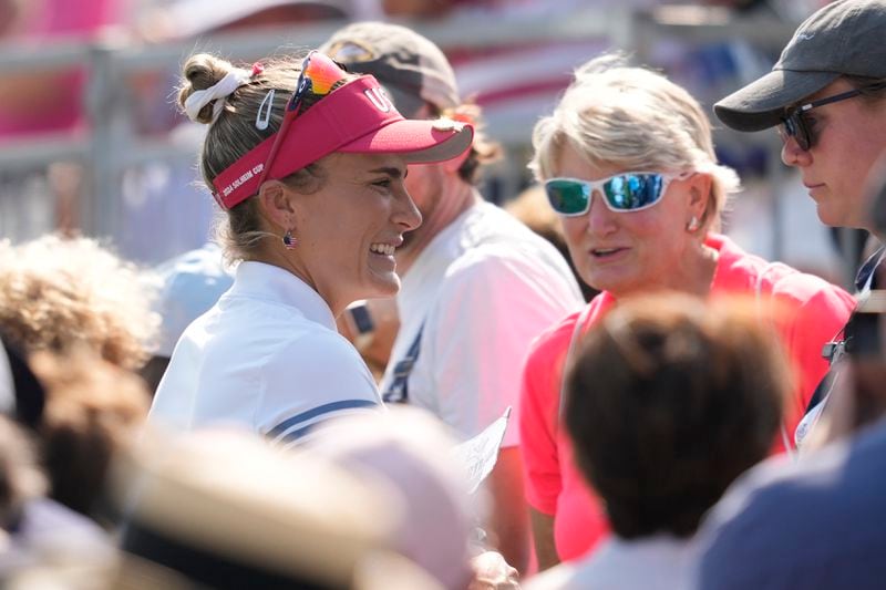 United States' Lexi Thompson smiles after winning a foursome match during a Solheim Cup golf tournament at Robert Trent Jones Golf Club, Saturday, Sept. 14, 2024, in Gainesville, Va. (AP Photo/Matt York)