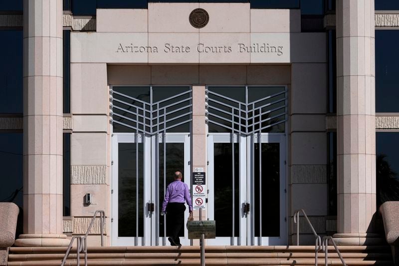 FILE - A man enters the Arizona Supreme Court building on April 10, 2024, in Phoenix. (AP Photo/Matt York, File)