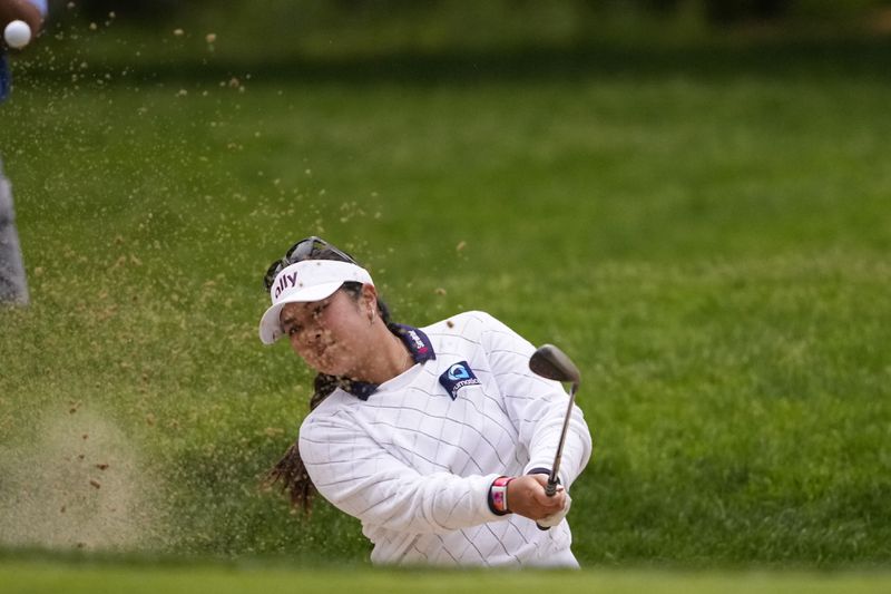 Lilia Vu hits out of the bunker onto the 14th green during the final round of the Women's PGA Championship golf tournament at Sahalee Country Club, Sunday, June 23, 2024, in Sammamish, Wash. (AP Photo/Lindsey Wasson)