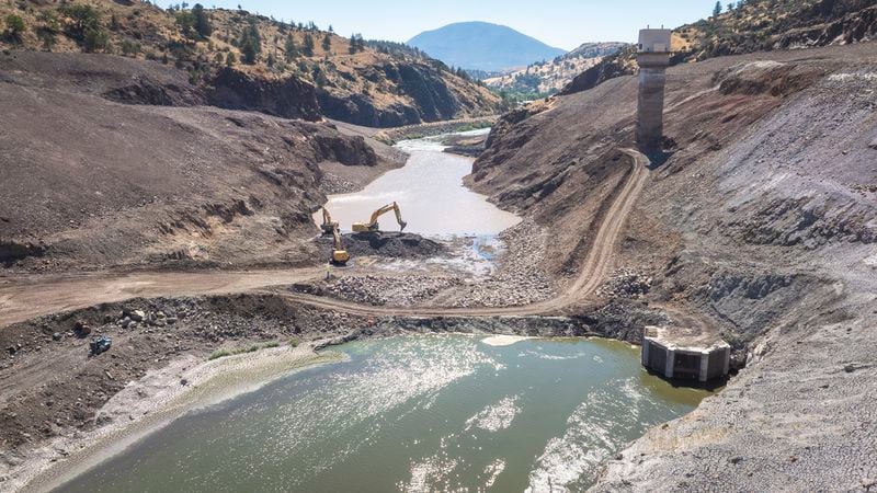 This image provided by Swiftwater Films shows a downstream view of crews working at the Iron Gate coffer dam site along the Klamath River on Tuesday, Aug. 27, 2024, in Siskiyou County, Calif. (Shane Anderson/Swiftwater Films via AP)