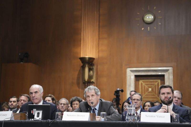 From right: Sen. J.D. Vance (R-Ohio), Sen. Sherrod Brown (D-Ohio) and Sen. Bob Casey (D-Pa.) appear before the Senate Committee on Environment & Public Works on Capitol Hill in Washington, March 9, 2023. In his prepared remarks released ahead of the hearing, Norfolk Southern Chief Executive Alan Shaw said he is “determined to make it right” for the people of East Palestine, Ohio, after a train derailed there last month. (Haiyun Jiang/The New York Times)
