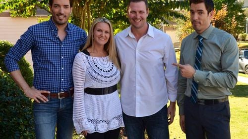 Melissa and Joe Durham (middle) pose with Property Brothers Jonathan Scott (left) and Drew Scott (right). (Courtesy Melissa Durham)