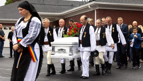 Mourners carry the casket of Ana Cristina Irimie, a math teacher killed at Apalachee High School during a school shooting, after her funeral service at Hamilton Mill Memorial Chapel and Gardens in Buford on Saturday, September 14, 2024. (Arvin Temkar / AJC)