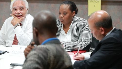 Nov 13, 2018 Decatur: DeKalb County Elections Board members Samuel Tillman (from left), Anthony Lewis, Erica Hamilton, Voter Registration and Elections Director, and Baoky Vu along with other board members vote unanimously to certify it's election results at the DeKalb County Elections office on Tuesday, Nov. 13, 2018, in Decatur.  Curtis Compton/ccompton@ajc.com