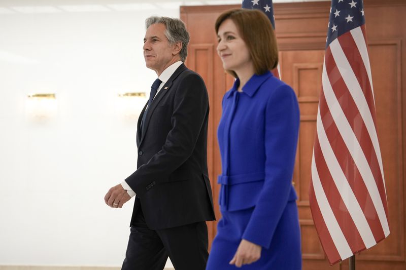 US Secretary of State Antony Blinken, left, walks with Moldova's President Maia Sandu at the Presidential Palace in Chisinau, Moldova, Wednesday, May 29, 2024. (AP Photo/Vadim Ghirda, Pool)