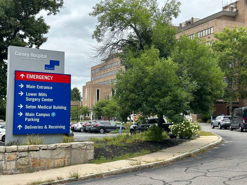 A direction board stands outside Carney Hospital in Boston, Tuesday, Aug. 20, 2024. (AP Photo/Nick Perry)