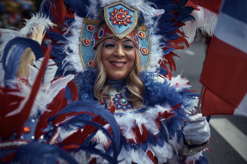 A reveler marches during the West Indian Day Parade on Monday, Sept. 2, 2024, in the Brooklyn borough of New York. (AP Photo/Andres Kudacki)