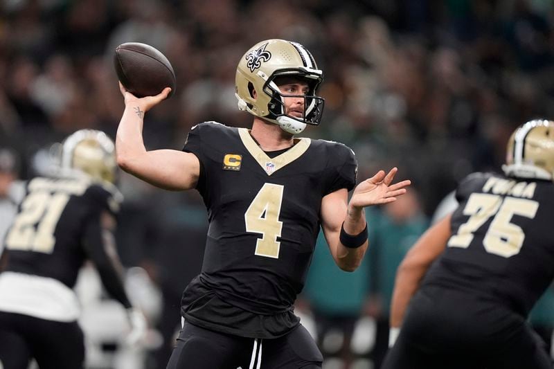 New Orleans Saints quarterback Derek Carr (4) passes against the Philadelphia Eagles in the first half of an NFL football game in New Orleans, Sunday, Sept. 22, 2024. (AP Photo/Gerald Herbert)