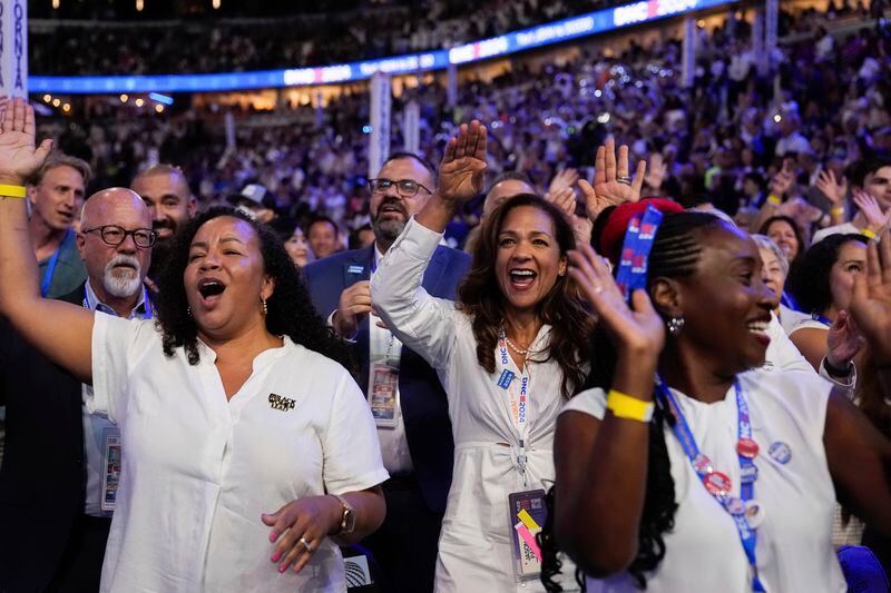 Delegates dance during the Democratic National Convention Thursday, Aug. 22, 2024, in Chicago. (AP Photo/Brynn Anderson)