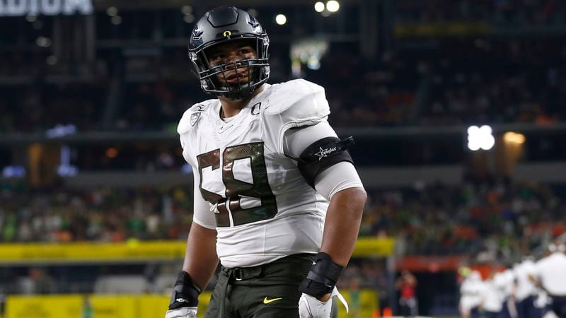 Oregon offensive lineman Penei Sewell (58) looks on as Oregon plays Auburn Aug. 31, 2019, in Arlington, Texas. (Ron Jenkins/AP)