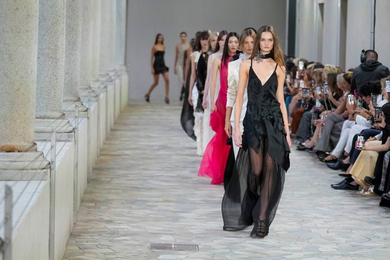 Models wear creations as part of the Alberta Ferretti Spring Summer 2025 collection, that was presented in Milan, Italy, Tuesday, Sept. 17, 2024. (AP Photo/Luca Bruno).