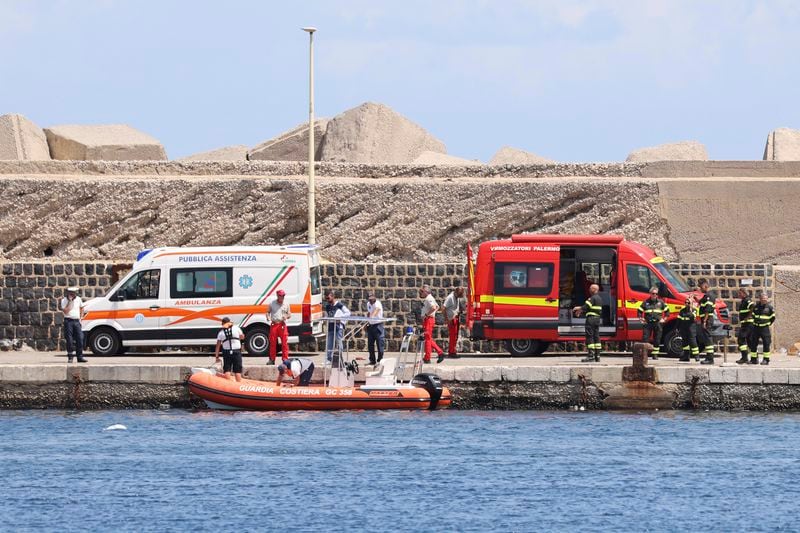 Emergency services at the scene of the search for a missing boat, in Porticello Santa Flavia, Italy, Monday, Aug. 19, 2024. British tech giant Mike Lynch, his lawyer and four other people are among those missing after their luxury superyacht sank during a freak storm off Sicily, Italy’s civil protection and authorities said. Lynch’s wife and 14 other people survived. (Alberto Lo Bianco /LaPresse via AP)