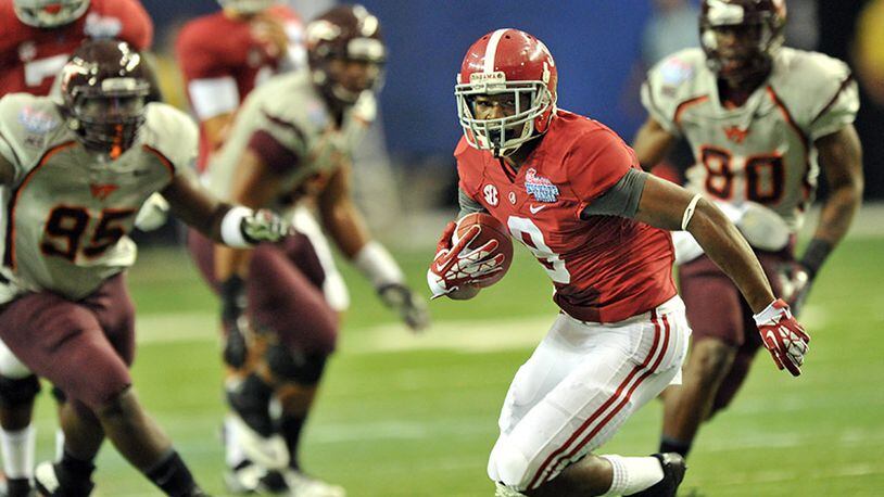 Alabama wide receiver Amari Cooper (9) catches a pass against