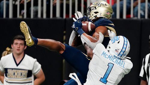 Georgia Tech wide receiver Malachi Carter (7) makes a catch for a touchdown as North Carolina defensive back Kyler McMichael (1) defends during the second half Saturday, Sept. 25, 2021, at Mercedes-Benz Stadium in Atlanta. (John Bazemore/AP)