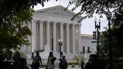People walk past the Supreme Court on Thursday, June 27, 2024, in Washington. (AP Photo/Mark Schiefelbein)