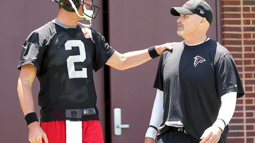 Falcons' coach hopes dog days are soon over with QB Vick