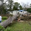 Linda Hall shows damages caused by Hurricane Helene at her daughter’s home, Tuesday, October 1, 2024, in Alapaha. Recovery efforts continue Sunday across Georgia’s 159 counties after Helene barreled through the state, causing catastrophic damage, flooding and at least 25 deaths. More than 400,000 people were still without power statewide after Helene entered South Georgia as a Category 2 hurricane around 1 a.m. Friday. Homes were destroyed, and neighborhoods were flooded across the state. (Hyosub Shin / AJC)