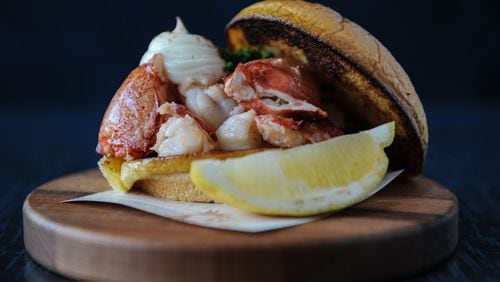 Lobster Roll - whole Maine lobster poached in butter, served warm on a toasted bun.