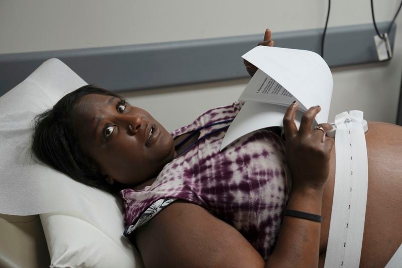 Denise Jones speaks with her Healthy Start care coordinator during a prenatal appointment at the Oklahoma State University obstetrics and gynecology clinic in Tulsa, Okla., on Tuesday, July 16, 2024. (AP Photo/Mary Conlon)