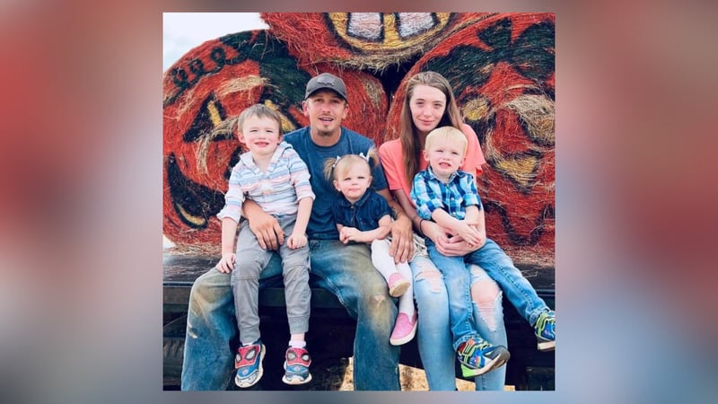 Madison Summerville, 23, and her husband with their three children. Summerville died a day after saving the kids from their burning Spalding County home.