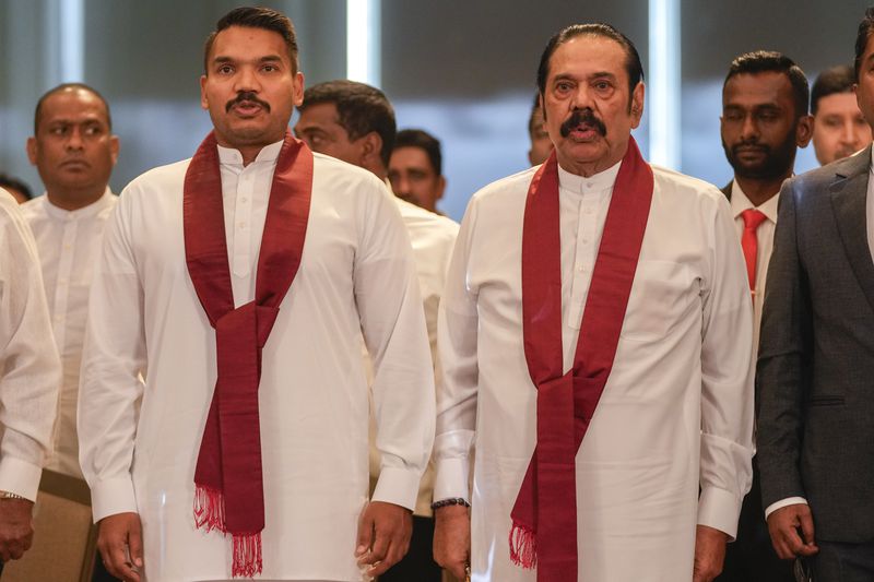 **HOLD**Presidential candidate Namal Rajapaksa, left, elder son of former president Mahinda Rajapaksa, right, attends the launching of his election manifesto in Colombo, Sri Lanka, Monday, Sept. 2, 2024. (AP Photo/Eranga Jayawardena, File)