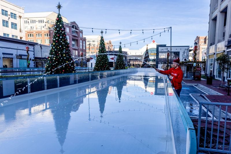 Chris Keresztes prepares Atlanta’s largest outdoor skating rink for its Friday opening at Atlantic Station on Tuesday, Nov. 14, 2023.   (Steve Schaefer/steve.schaefer@ajc.com)