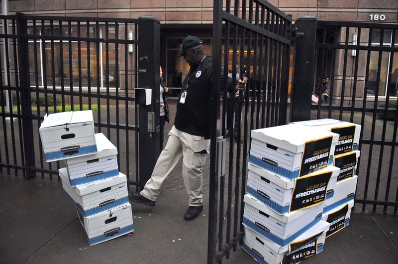 February 12, 2019 Atlanta - In order to clear a pathway outside the Atlanta Immigration Court, a gaurd kicks aside several boxes with more than 445,000 petition signatures demanding the release of 21 Savage. U.S. Immigration and Customs Enforcement arrested the Grammy-nominated rapper the morning of February 3, claiming that he is actually from the United Kingdom and overstayed his visa. Ten organizations, including Color Of Change, delivered more than 445,000 petition signatures demanding the release of 21 Savage. RYON HORNE / RHORNE@AJC.COM