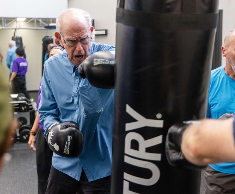 Frank Ryan hits a punching bag in Rock Steady Boxing. He attends the class four times a week and believes that's helping to delay the progression of his Parkinson's disease. The classes are held at Wellstar Health Place on the campus of Kennestone Hospital. Rock Steady Boxing doesn't take insurance, but some insurers will reimburse participants on a case-by-case basis.
 PHIL SKINNER FOR THE ATLANTA JOURNAL-CONSTITUTION