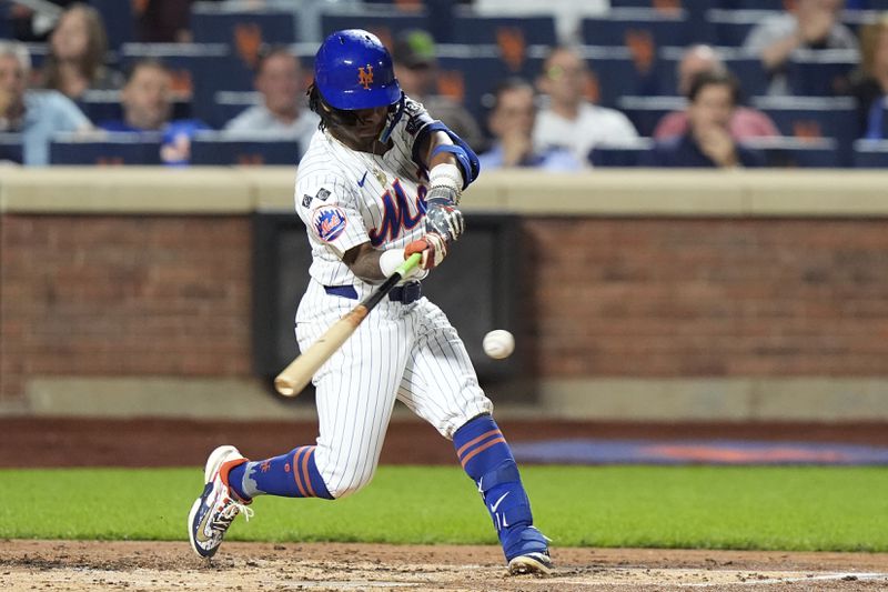 New York Mets' Luisangel Acuña hits an RBI double during the third inning of a baseball game against the Washington Nationals, Tuesday, Sept. 17, 2024, in New York. (AP Photo/Frank Franklin II)