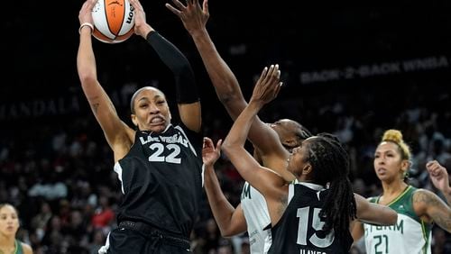 Las Vegas Aces center A'ja Wilson (22) grabs a rebound against the Seattle Storm during the second half in Game 2 of a WNBA basketball first-round playoff game Tuesday, Sept. 24, 2024, in Las Vegas. (AP Photo/John Locher)