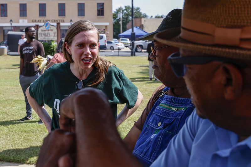 Alabama's new 2nd Congressional District Republican candidate Caroleene Dobson talks with voters during the Macon County Day Festival in Tuskegee, Ala., on Saturday, Aug 31, 2024. (AP Photo/ Butch Dill)