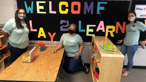 BBB ambassadors Rosalinda Perez (left) and Paola Aramendiz (middle) share information with GCPS Early Learning Specialist Carolina Worthington (right) at one of the three Gwinnett County Public Schools flagship programs called Play 2 Learn - a condensed pre-school experience teaching parents to be that teacher at home.