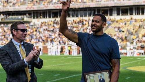 Former Georgia Tech All-American and 2009 ACC defensive player of the year Derrick Morgan acknowledges fans at halftime of Tech's game against North Carolina at Bobby Dodd Stadium Oct. 5, 2019. Morgan was inducted into Tech's sports hall of fame the previous night. (Danny Karnik/Georgia Tech Athletics)