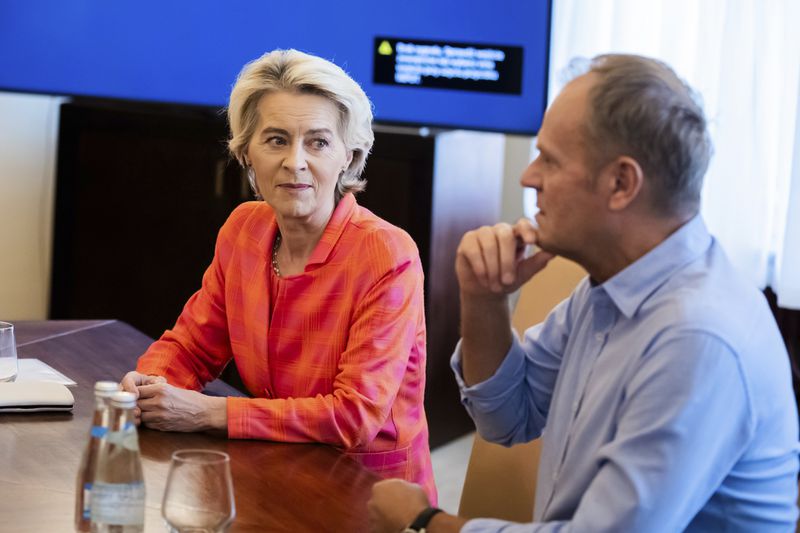 European Commmission President Ursula von der Leyen, left, meets with Poland's Prime Minister Donald Tusk, at the town hall in Woclaw, Poland, Thursday, Sept. 19, 2024. (Christoph Soeder/DPA via AP, Pool)