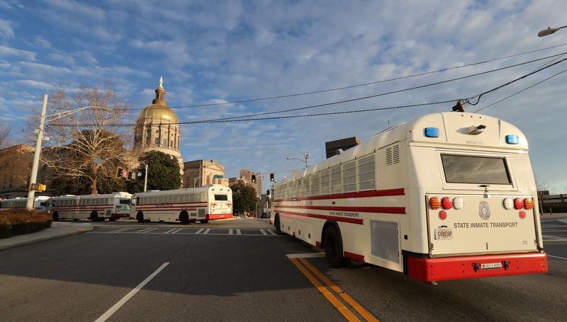 1/17/21 - Atlanta -  State Inmate Transport busses with corrections officers on board arrived at the state Capitol Sunday.  (Curtis Compton / Curtis.Compton@ajc.com)  