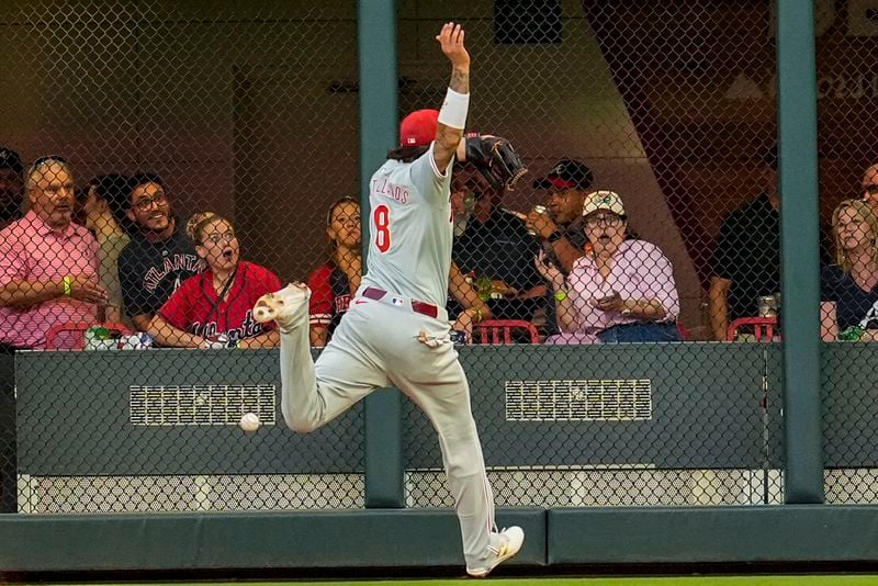 in the xx inning of a baseball game, Thursday, Aug. 22, 2024, in Atlanta. (AP Photo/Mike Stewart)