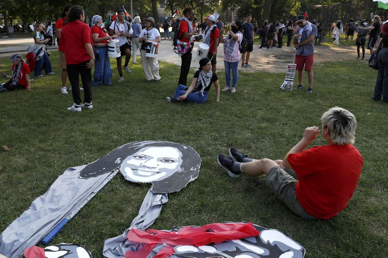 A poster cutout of Democratic presidential nominee Kamala Harris sits on the ground after a March on DNC protest on Monday, Aug. 19, 2024, in Chicago. Protesters, including March on DNC organizers, want the vice president to push harder for a cease-fire and to persuade President Biden to end aid to Israel. (AP Photo/Martha Irvine)