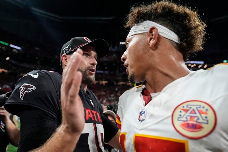 Atlanta Falcons quarterback Kirk Cousins speaks with Kansas City Chiefs quarterback Patrick Mahomes after an NFL football game, Sunday, Sept. 22, 2024, in Atlanta. The Kansas City Chiefs 22-17. (AP Photo/Brynn Anderson)